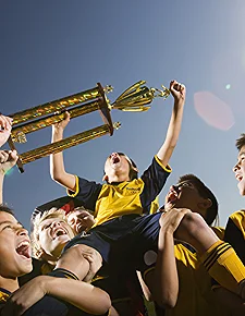 Victorious Team Celebrating With Trophy Under Clea 2026 01 09 11 35 49 Utc